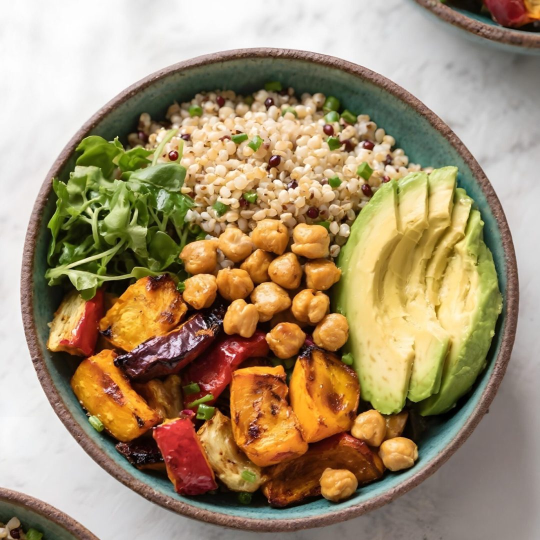 colorful buddha bowl with avocado roasted vegetables